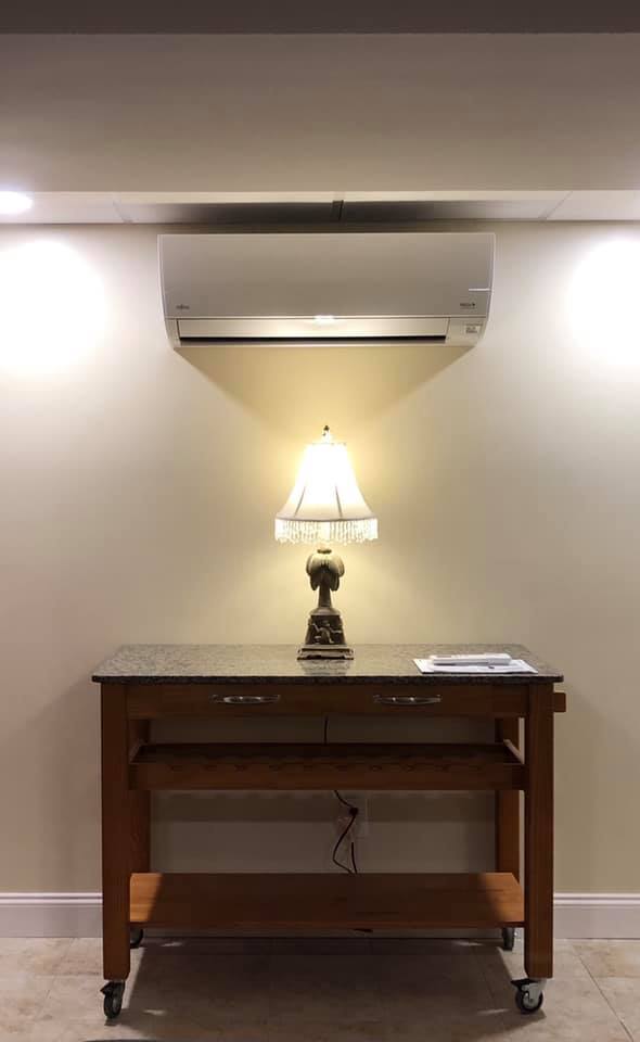 Wall-Mount Heat Pump Above Lamp